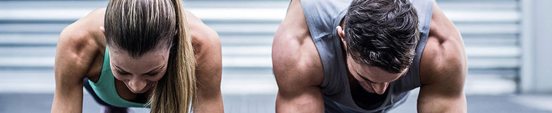 Woman and man doing plank