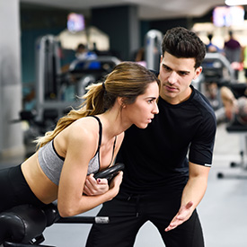 Bear Fitness trainer giving assistance